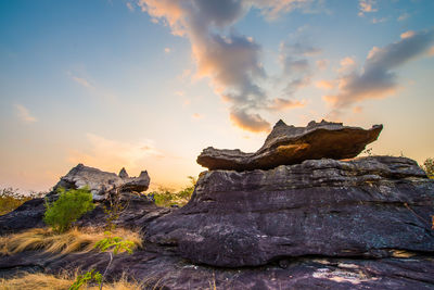 Rock formations against sky during sunset