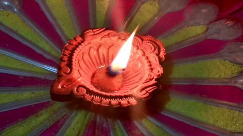 Close-up of illuminated lantern on table