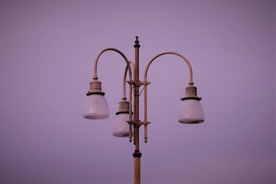 Low angle view of street light against sky