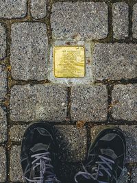 Low section of person standing on street