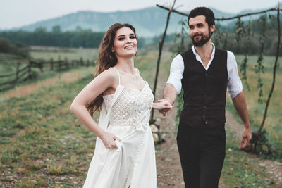 Young couple standing outdoors