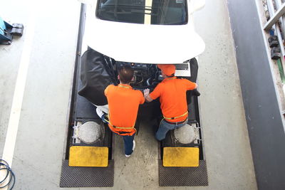 High angle view of orange car on street