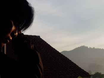 Portrait of woman against sky