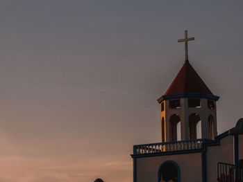 Low angle view of building against sky during sunset