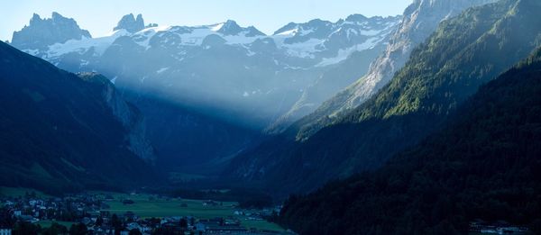 Scenic view of snowcapped mountains against sky