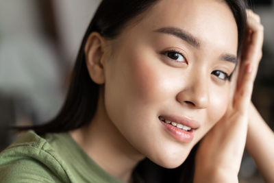 Close-up portrait of young woman