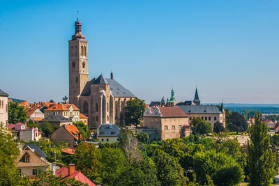 View of buildings in city against clear sky