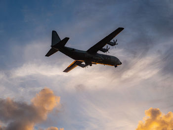 Low angle view of airplane flying in sky