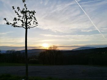 Scenic view of landscape against sky at sunset