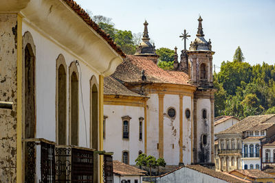 Old baroque church among the houses, balconies and windows of the city of ouro preto in minas gerais