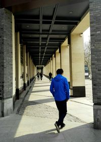 Full length rear view of woman standing in park