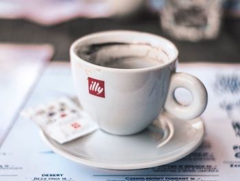 Close-up of coffee cup on table