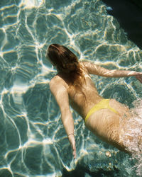 High angle view of woman swimming in pool