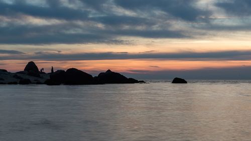 Scenic view of sea against sky at sunset