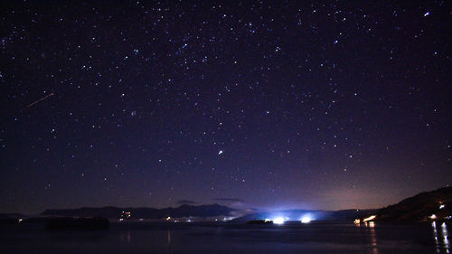 Scenic view of star field against sky at night