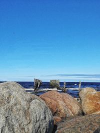 Scenic view of sea against clear blue sky