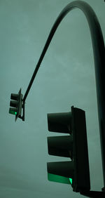 Low angle view of street light against sky