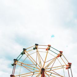 Low angle view of ferris wheel against sky