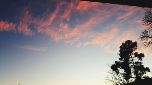 Low angle view of cloudy sky at sunset