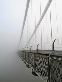 Suspension bridge in foggy weather