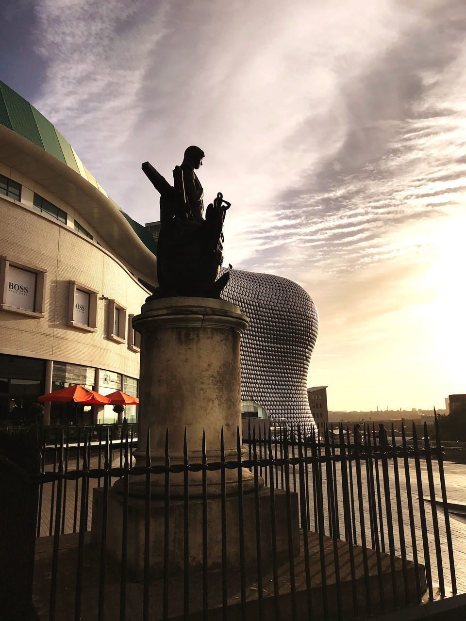 LOW ANGLE VIEW OF STATUE AGAINST SKY DURING SUNSET