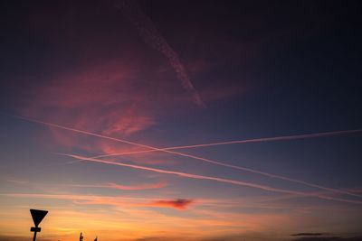 Low angle view of vapor trails in sky