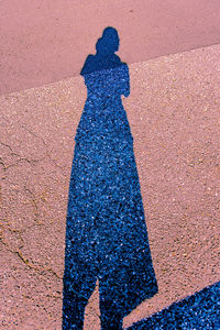 Shadow of woman on street