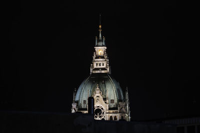 Traditional building against sky at night