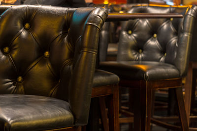 Lounge chairs by table in restaurant