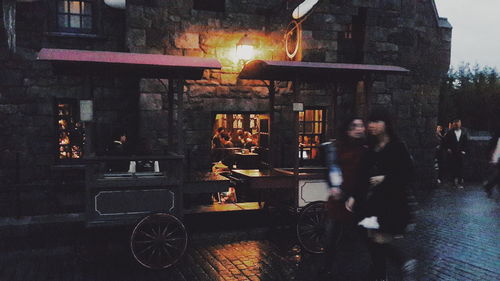 Man in illuminated city at night