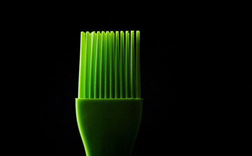 Close-up of green drink against black background