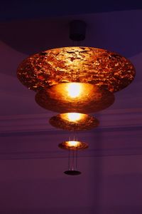 Low angle view of lit lamp