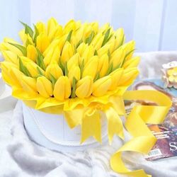 Close-up of yellow flowers on table