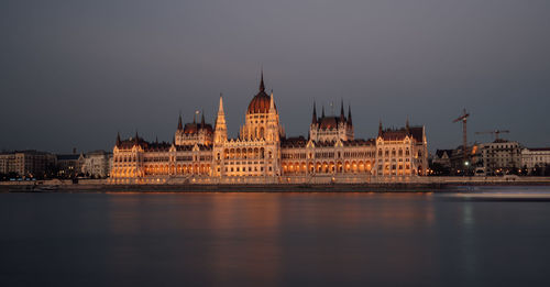 Illuminated city at waterfront