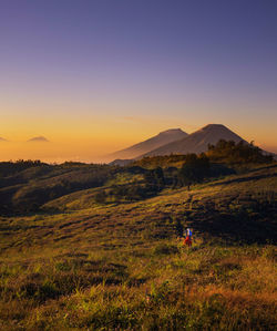 Scenic view of landscape against sky during sunset