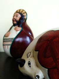 Close-up of female statue on table