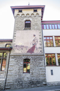 Low angle view of statue against building