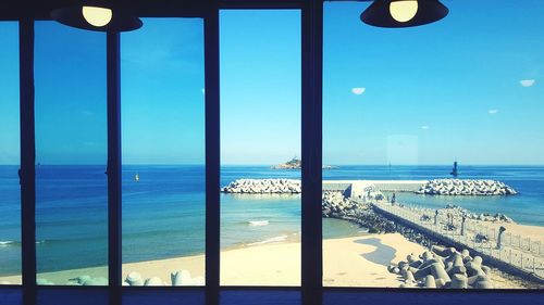 Scenic view of sea against blue sky