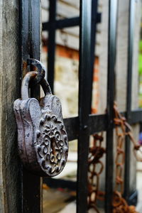 Close-up of padlock on metal door