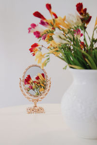 Close-up of white flower vase on table