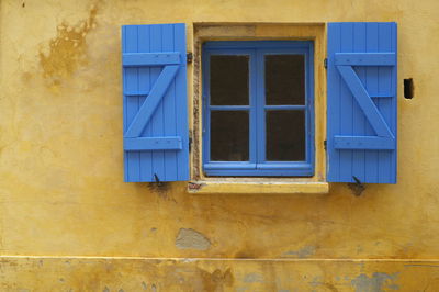 Low angle view of yellow window