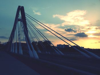 Low angle view of bridge against sky during sunset