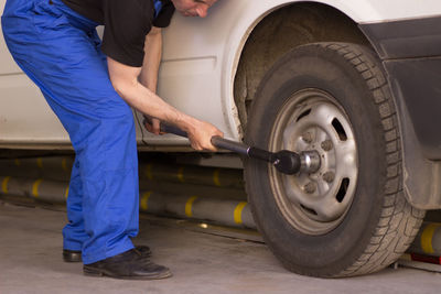 Low section of man working on street