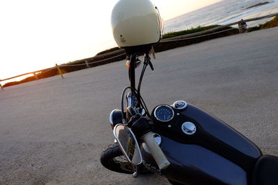 Close-up of bicycle on road against sky