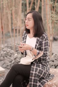 Young woman using mobile phone