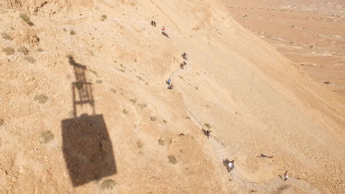 High angle view of footprints on sand