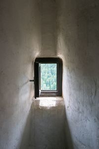 High angle view of woman standing against wall