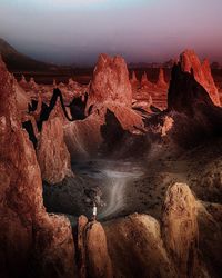 Rock formations on landscape against sky