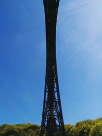 Low angle view of metallic structure against clear blue sky
