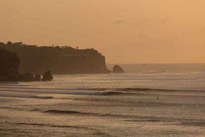 Scenic view of sea against clear sky during sunset